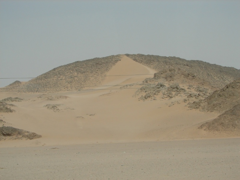 Desert on other side blows a river of sand.jpg